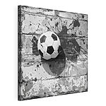 Obraz Futbalová lopta na tehlovej stene